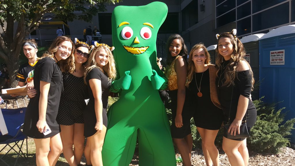People posing with Gumby.