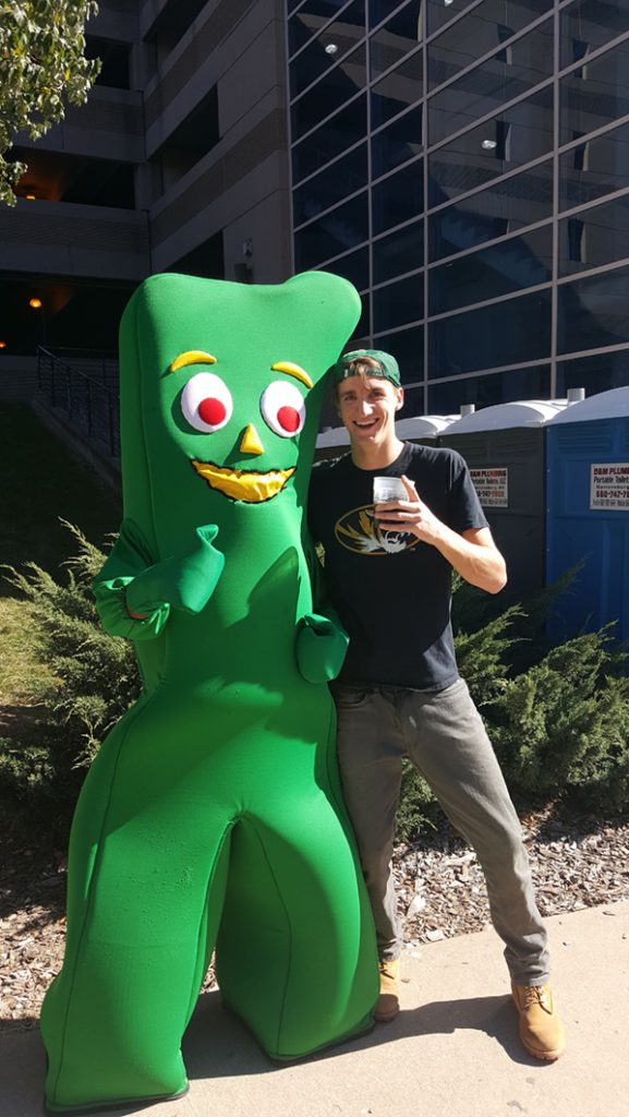 People posing with Gumby.