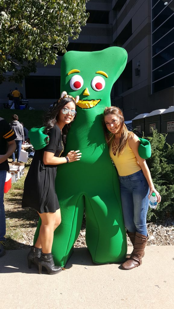 People posing with Gumby.